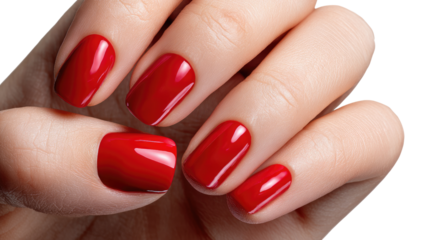 Red Nails: A close-up of a hand reveals manicured nails, showcasing a vibrant red polish, a timeless beauty statement.