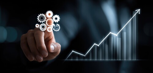 A hand touches a glowing gear graphic overlaid on a rising bar graph