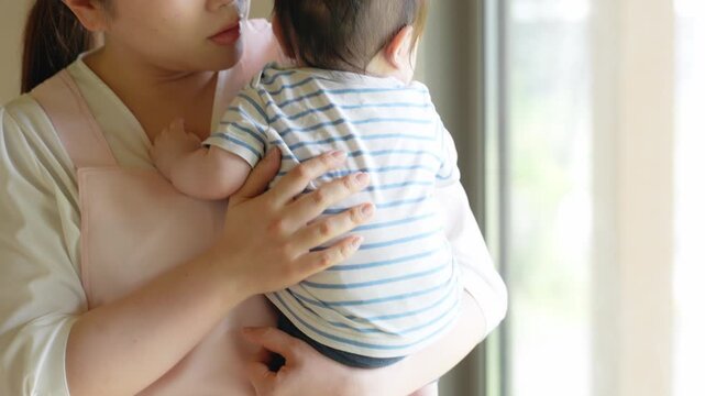 baby, infant, mother, boy, mum, birth, babysitting, sitter, mama, apron, childcare, parenting, soothing, crying, fussy, cuddle, nursery teacher, nursery school, daycare, smile, kid, child, newborn, ch