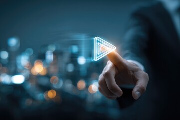 Business hand interacts with a glowing play button over a blurred cityscape