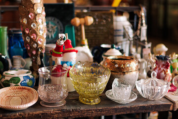 Colorful kitchen and shelf displaying antique-style dishes