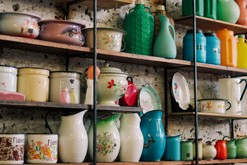 Colorful kitchen and shelf displaying antique-style dishes