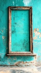 Aged teal frame on weathered wall