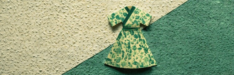 Paper kimono-style dress, light cream and teal background