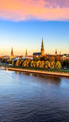 Fototapeta premium Autumn cityscape by the river