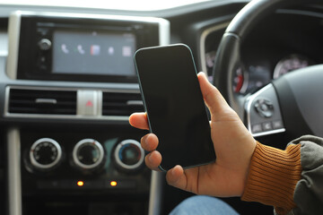 The driver searches for directions on his phone.