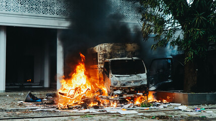 Destroyed Truck Burning on the Street During a Riot or Protest
