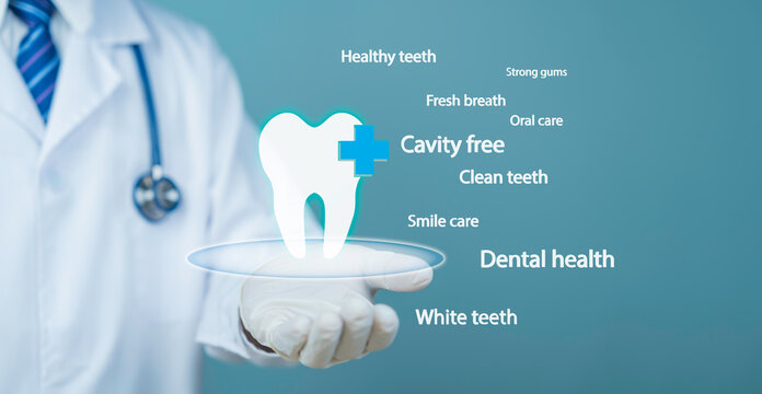 Doctor holding digital tooth icon dental health cavity free oral care hygiene clean white teeth medical healthcare concept background