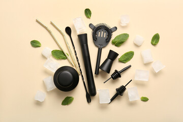 Composition with bartender utensils, ice cubes and mint leaves on beige background