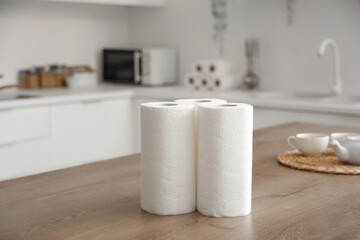 Rolls of paper towels on table in kitchen
