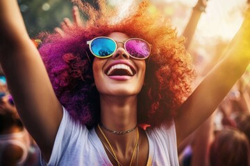 Energetic young woman with red afro enjoying music festival, surrounded Happy at open air