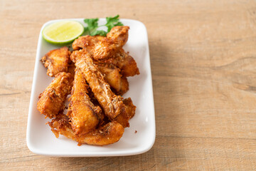 Fried Snapper Belly on white plate