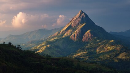 Mountain peak at sunset, lush valley
