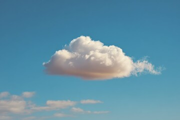 Solitary cloud against a vivid blue sky