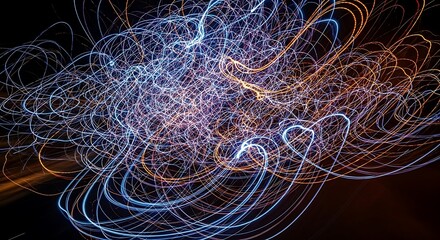 Abstract light trails swirling in dark space