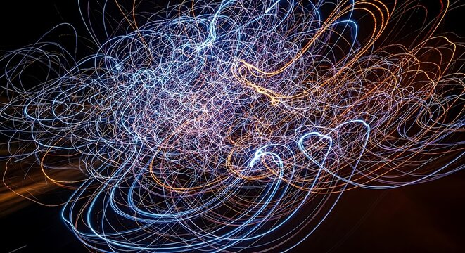 Abstract light trails swirling in dark space