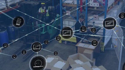 Animation of icons connected with lines over multiracial coworkers working in warehouse - Powered by Adobe