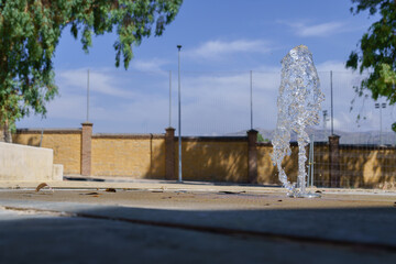 Small fountain refreshing a city park during a sunny day