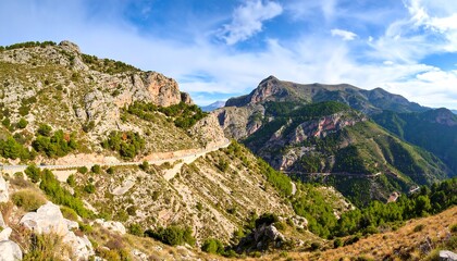 Naklejka premium Mountainous road winding through a valley