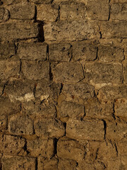 Close-up of historic stone wall texture from Nizhny Novgorod Kremlin. Historic building materials concept. Handheld mobile photo, selective focus, sunlight, non AI