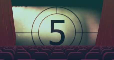 Animation of circle with retro movie countdown in empty cinema theater with red chairs and curtains - Powered by Adobe