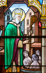 Stained glass (19th century) of Saint Nicholas, bishop of Myre, and the three children in the salt...