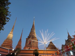 Fototapeta premium Electric lighting decoration for celebrate in Wat pho temple under evening sky