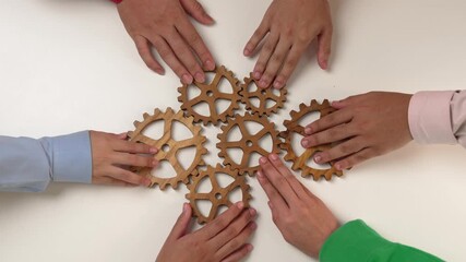 Panorama video of wooden cogwheel gear separate each other symbolize share the work function productive system in business company and synergy teamwork with effective and efficiency working. Synergic