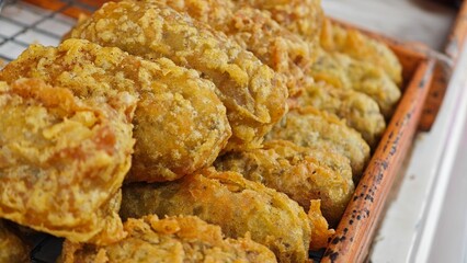 Deep fried unripe rice grain.