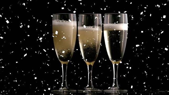 Animation of confetti over glasses of champagne