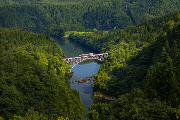 Tadami line train cars crossing the first Tadami-River bridge in Fukushima
