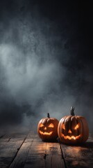 Eerie Halloween Scene with Glowing Jack-o'-Lanterns Surrounded by Misty Atmosphere and Wooden Plank Background