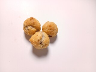   profiterole with chocolate filling on a white background