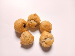   profiterole with chocolate filling on a white background