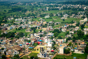 Contrasting Development: Dense Rural Village and Modern Highway in India