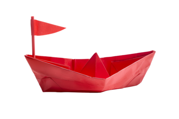 Red paper boat with flag sailing on black background