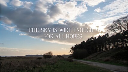 Scenic landscape under a vast sky with inspirational quote
