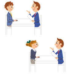 先生と生徒が机を挟んで対面して会話している