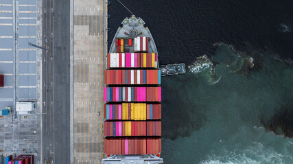 Aerial view container cargo ship at port with tugboat, Business global import export logistic...