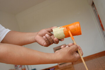 Painting bamboo crafts orange