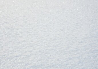 Fototapeta premium A close-up of a sparkling, sunlit snow texture with a clean and minimalist aesthetic.