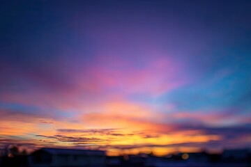 Obraz premium Blurry sunset over houses