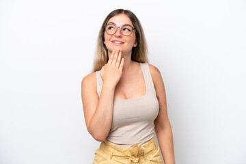 Young Rumanian woman isolated on white background looking up while smiling