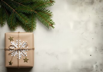 Brown gift box with snowflake and stars decoration beside a green pine branch