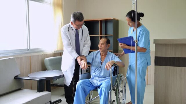 Doctor and nurse take care patient old man with intravenous treatment in wheelchair at hospital	