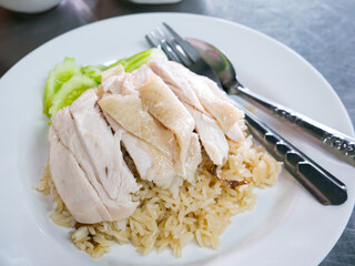 Hainanese Chicken Rice Served on Table in Restaurant. Asian Traditional Food.
