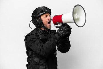 Middle age SWAT man isolated on white background shouting through a megaphone