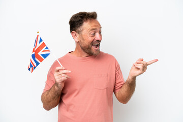 Middle age caucasian man holding English flag isolated on white background pointing finger to the...