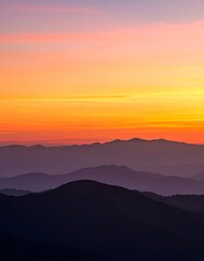 Fototapeta premium Sunrise over Misty Mountain Ranges.