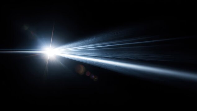 Bright light rays streaking across a black background